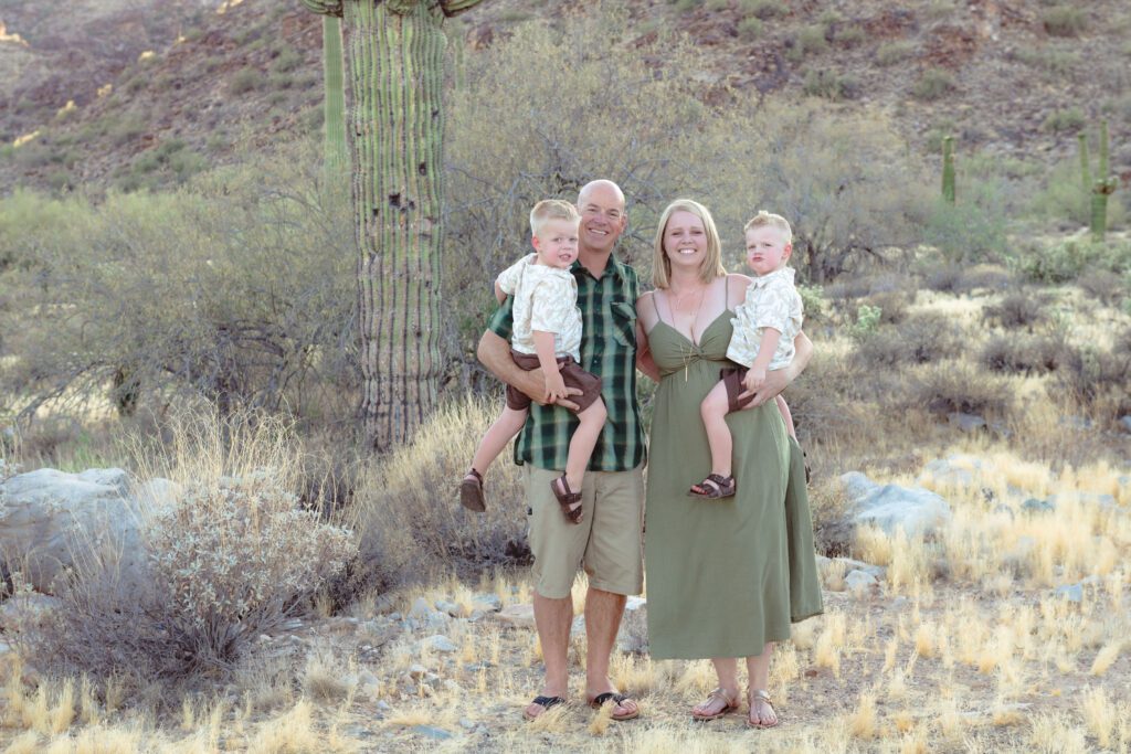 Nicholas Estelle with his wife and twin boys in the Arizona desert