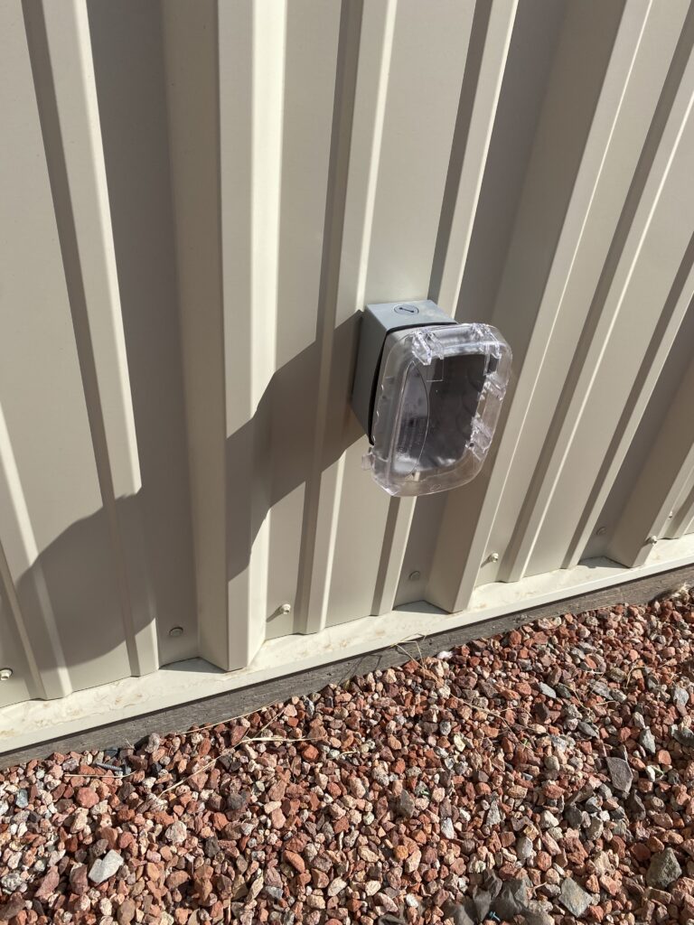 Exterior security light on a metal building