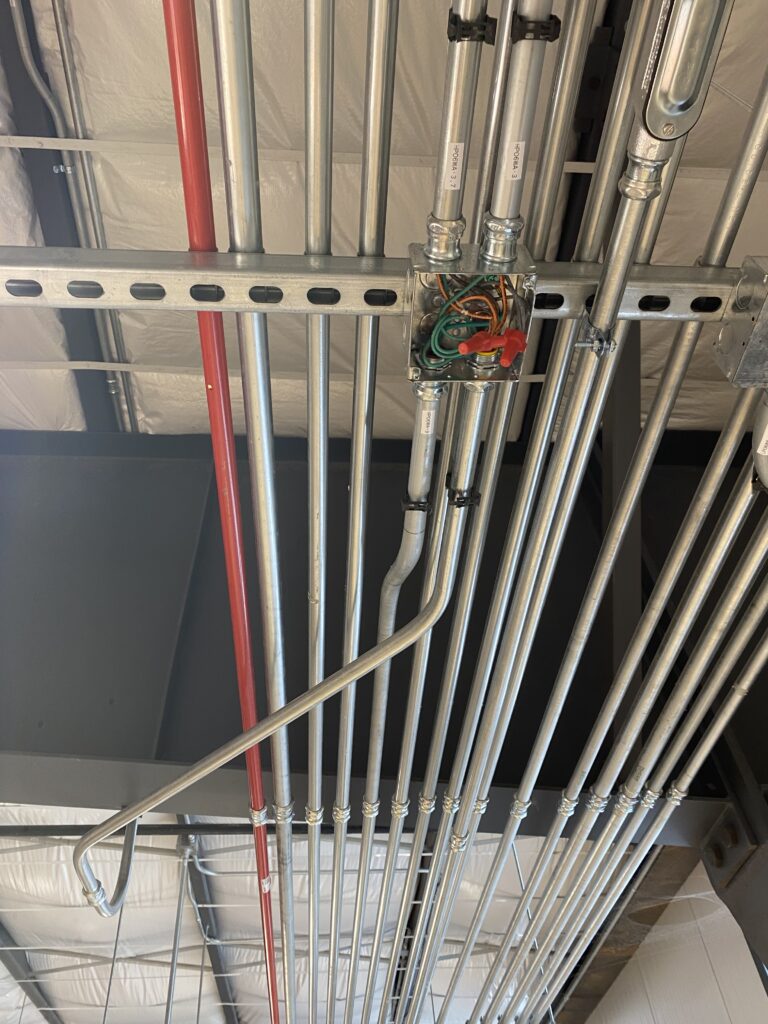 Parallel conduit runs installed in a commercial building in the West Valley, AZ