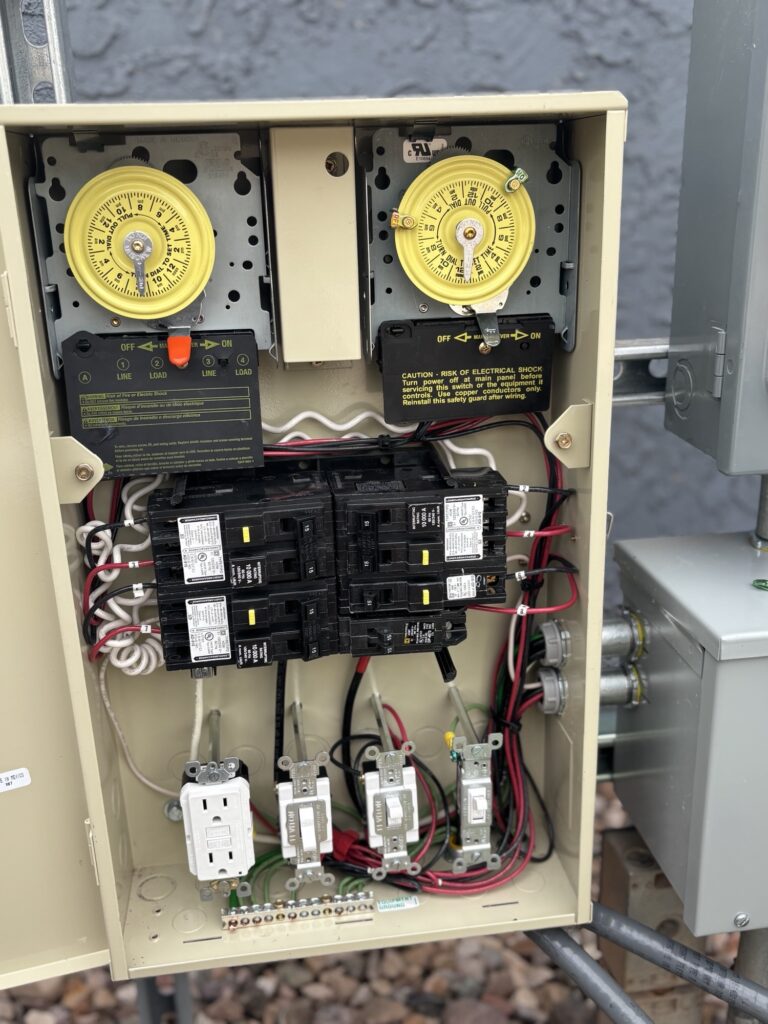 Pool equipment panel with timers and breakers